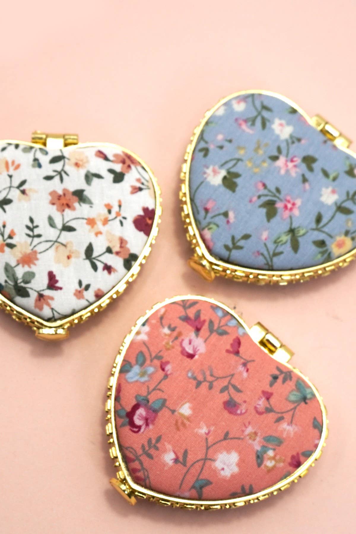 Josslyn travel pocket compact handheld mirror with floral pattern, small and lightweight for easy portability.