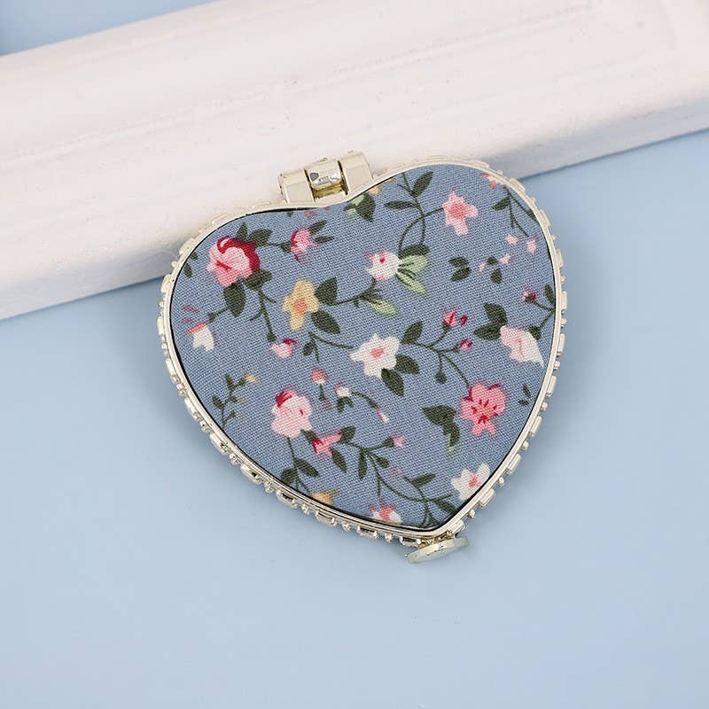 JOSSLYN travel pocket compact handheld floral mirror, small round mirror with a floral pattern design for on-the-go use.