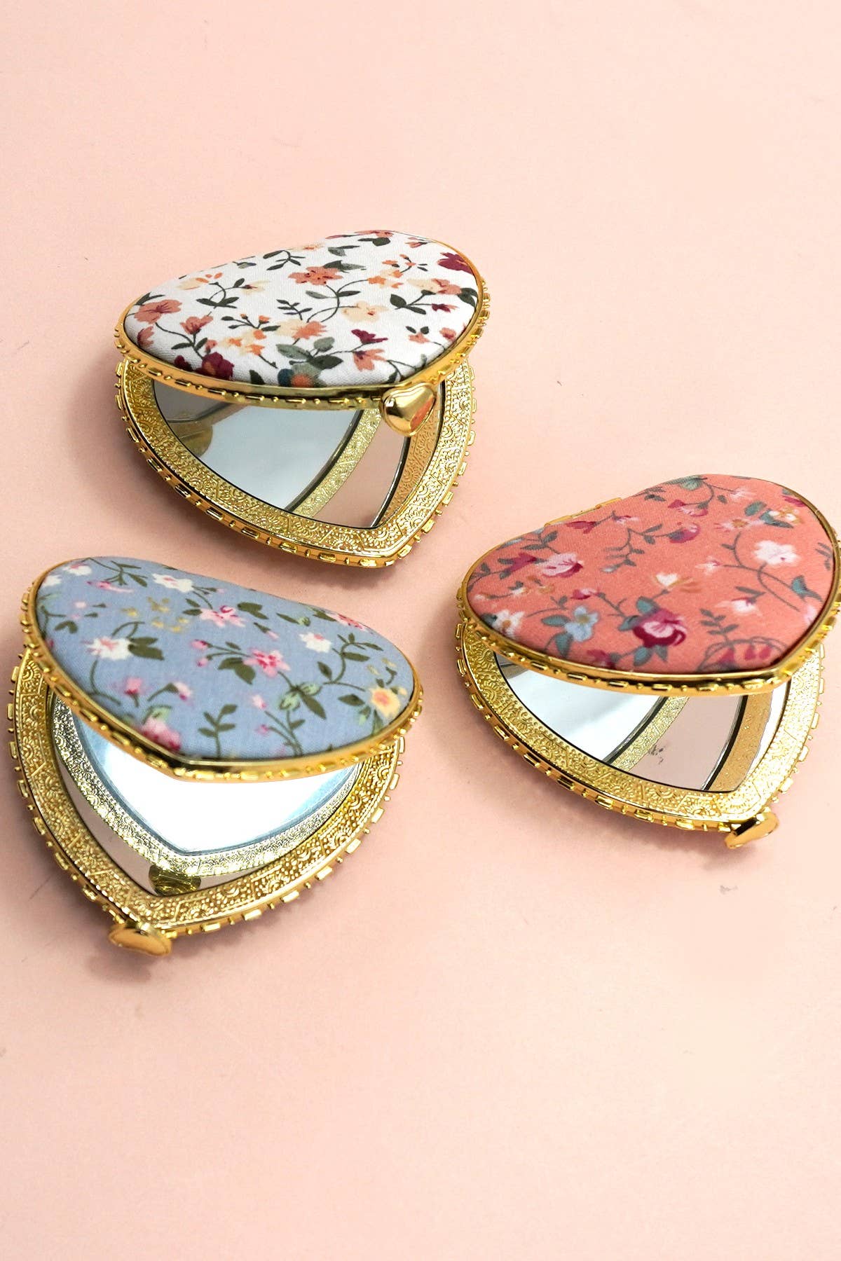 JOSSLYN travel pocket compact handheld floral mirror with a decorative floral pattern on the cover, small and portable for on-the-go use.