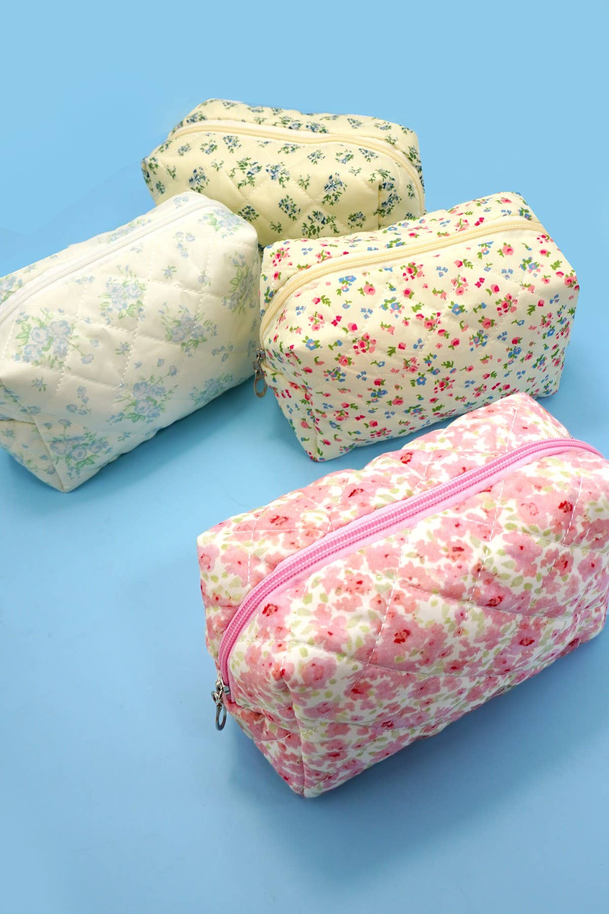 JOSSLYN floral toile pattern makeup cosmetic pouch bag with zipper closure, featuring colorful flower designs on fabric.