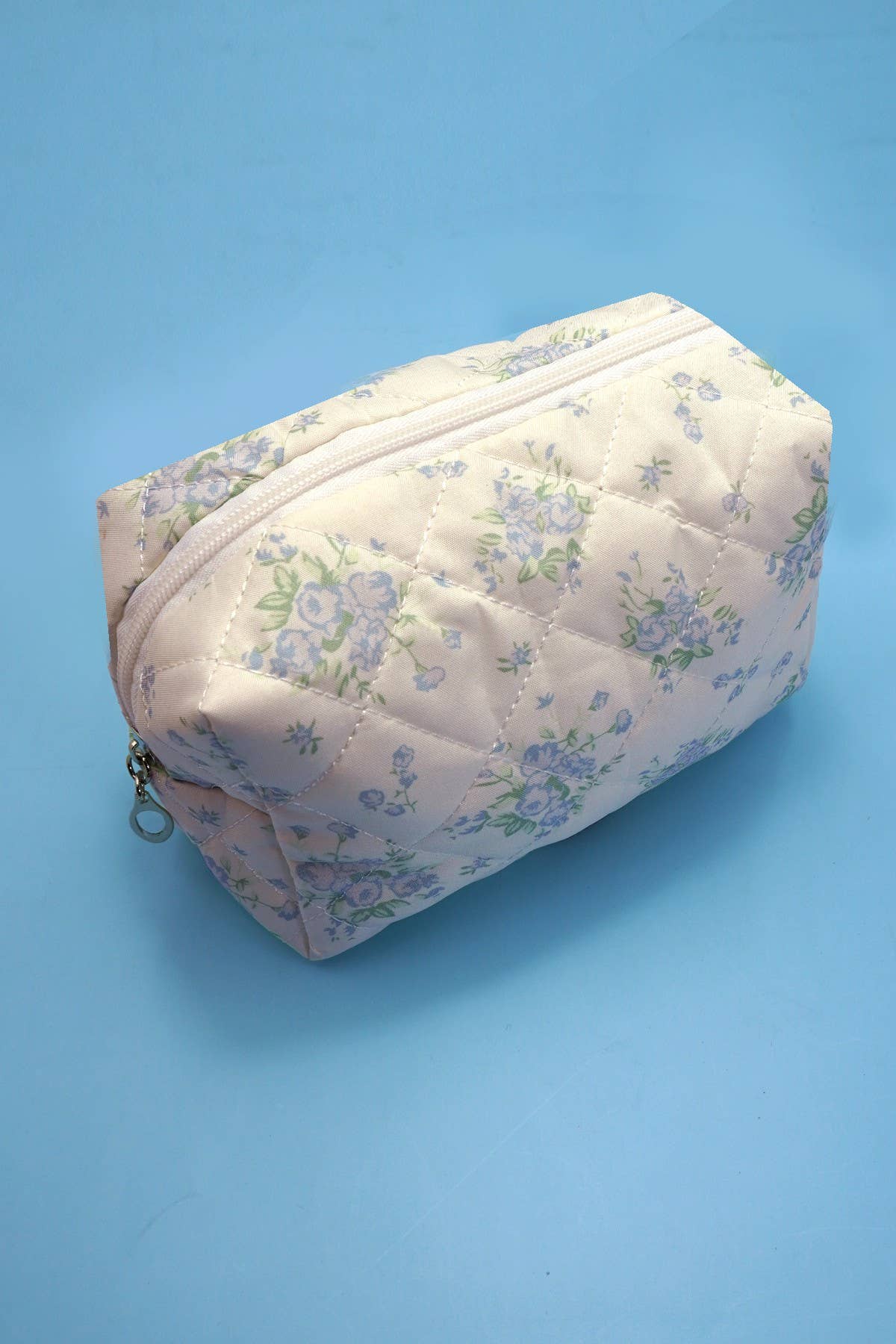 JOSSLYN floral toile pattern makeup cosmetic pouch bag with zipper closure and colorful floral design.
