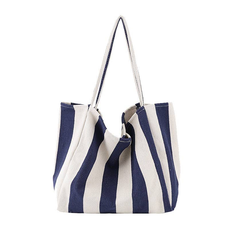 JOSSLYN striped trending tote bag with blue, white, and red horizontal stripes, large open main compartment, durable handles.