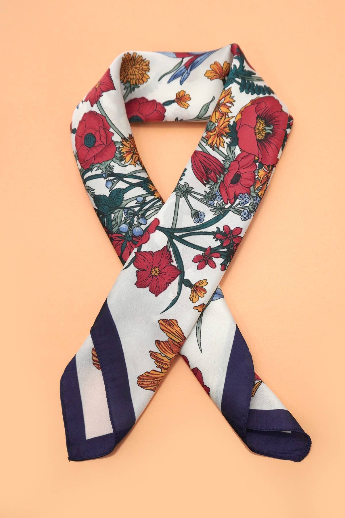 Large floral print bandana scarf by JOSSLYN featuring vibrant floral patterns on soft fabric.