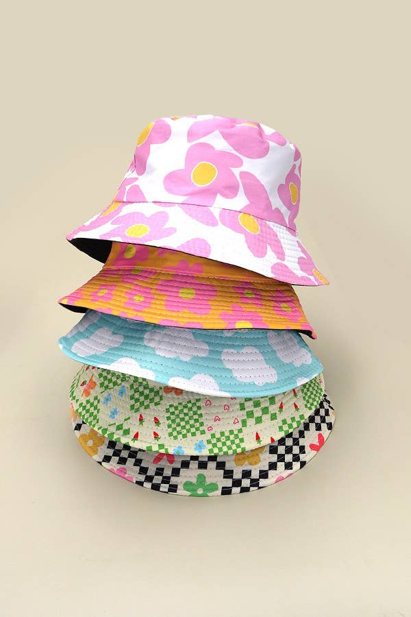 JOSSLYN floral bucket hat with colorful flower pattern, wide brim, and casual style perfect for sunny outdoor wear.