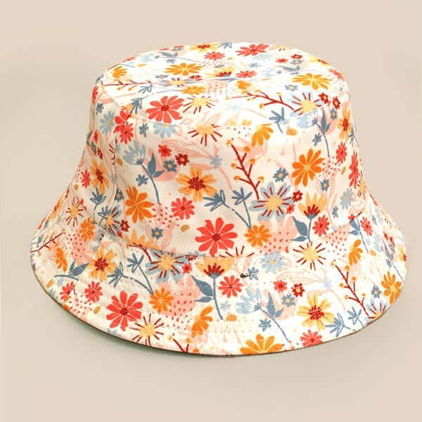 JOSSLYN floral bucket hat with colorful flower pattern, wide brim, and casual summer style.