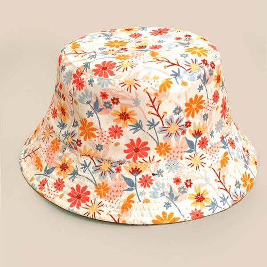 JOSSLYN floral bucket hat with colorful flower pattern, wide brim, and casual summer style.