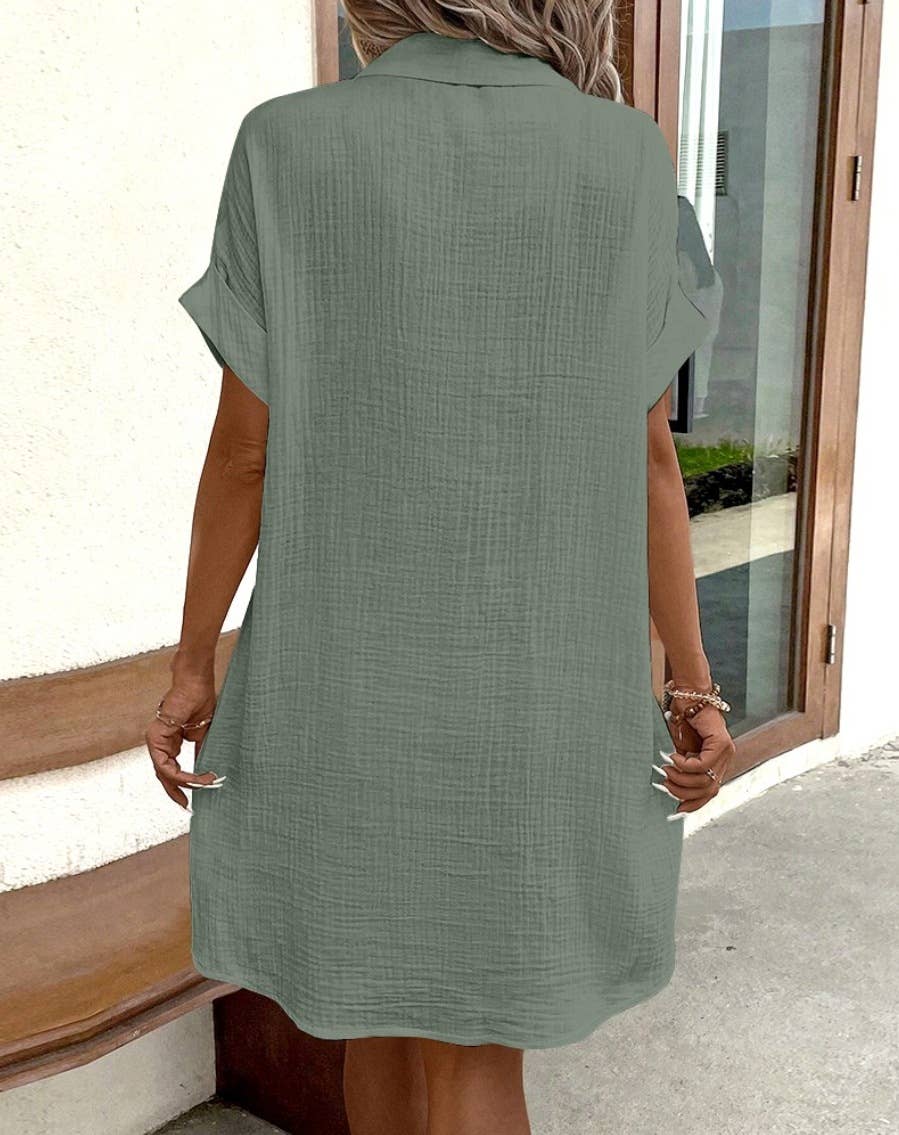 Lily Clothing solid color V-neck shirt dress hanging on a wooden hanger, showcasing a casual and comfortable style.