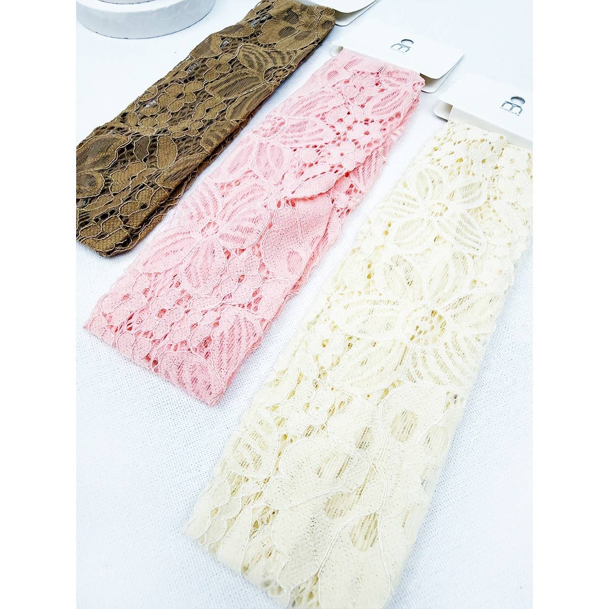 Love and Repeat stretch lace headwrap, a stylish hair accessory with delicate lace fabric and versatile design.