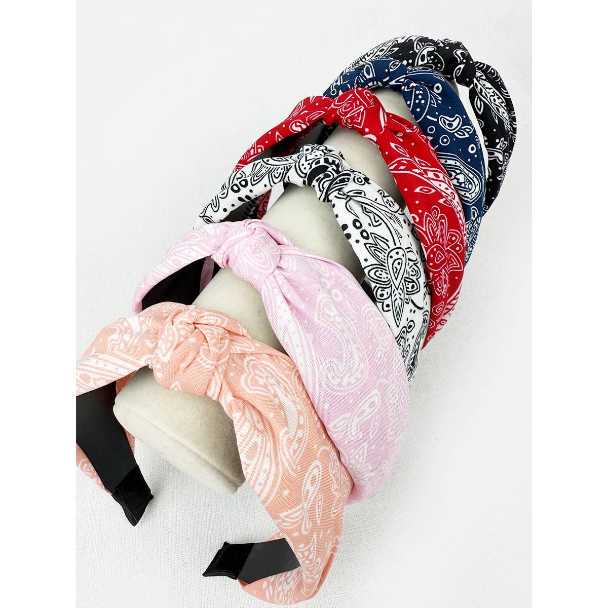 Love and Repeat bandana knot hairband featuring a stylish fabric design, perfect for casual or boho hairstyles.