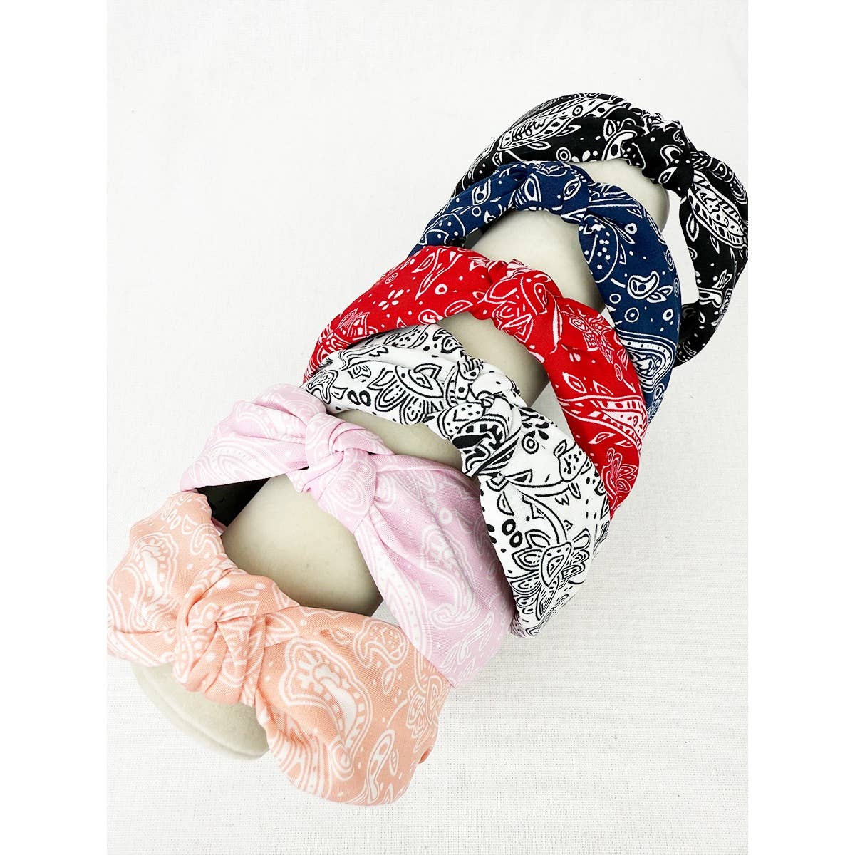 Love and Repeat bandana knot hairband featuring a stylish patterned fabric tied at the front.