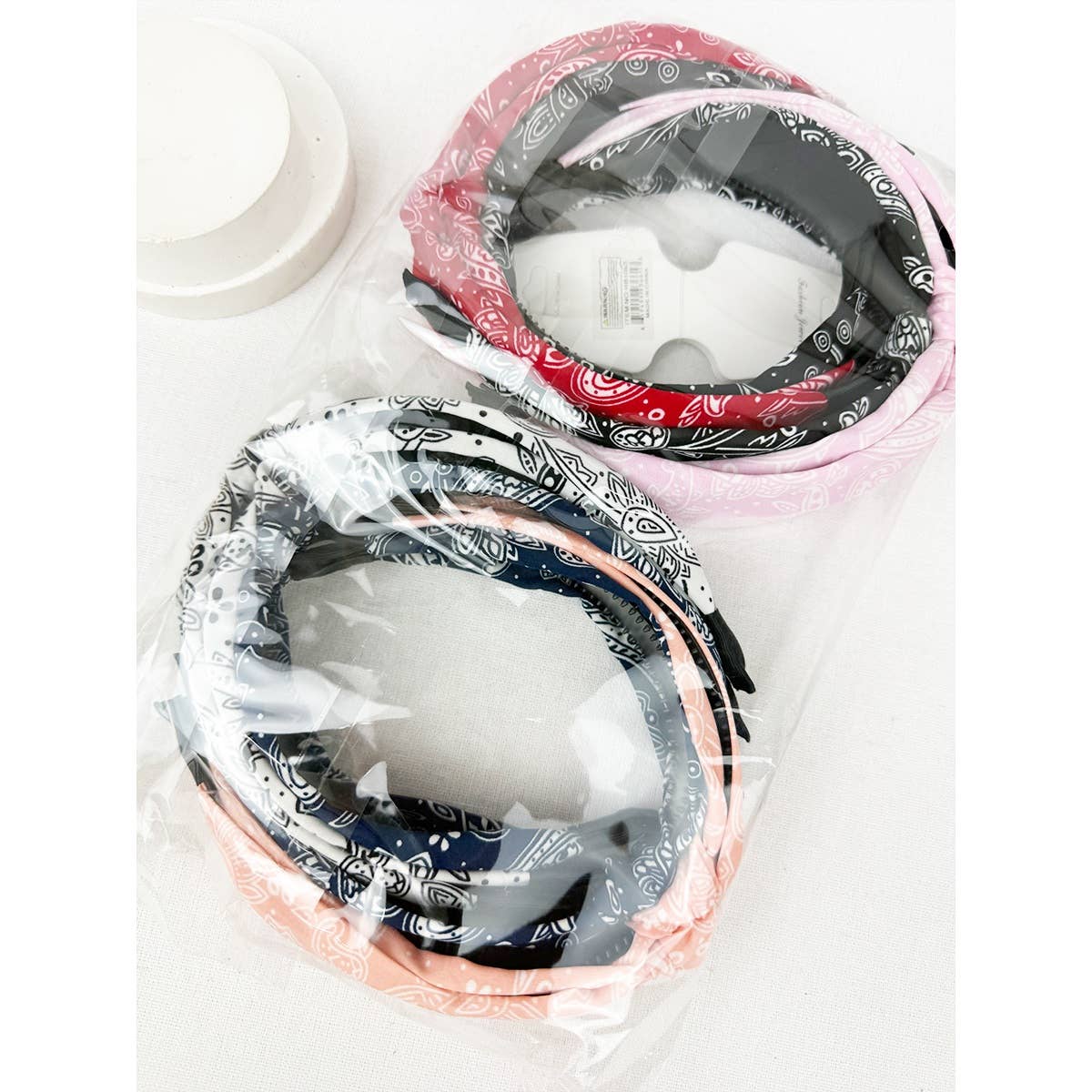 Love and Repeat bandana knot hairband with colorful fabric, stylish accessory for hair styling and casual wear.