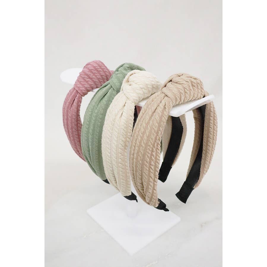 Love and Repeat ribbed knotted headband with a textured fabric and stylish knot detail, perfect for hair accessories.
