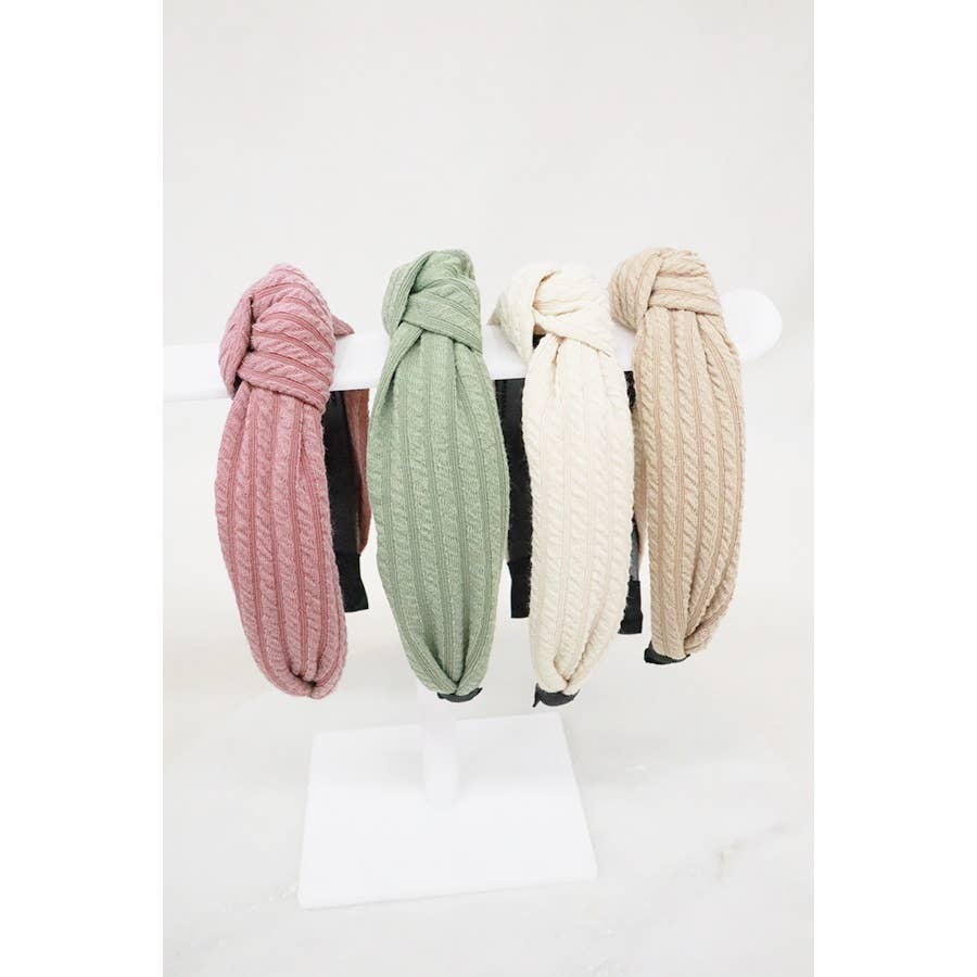 Ribbed knotted headband by Love and Repeat featuring a textured fabric and stylish knot detail for a trendy accessory.