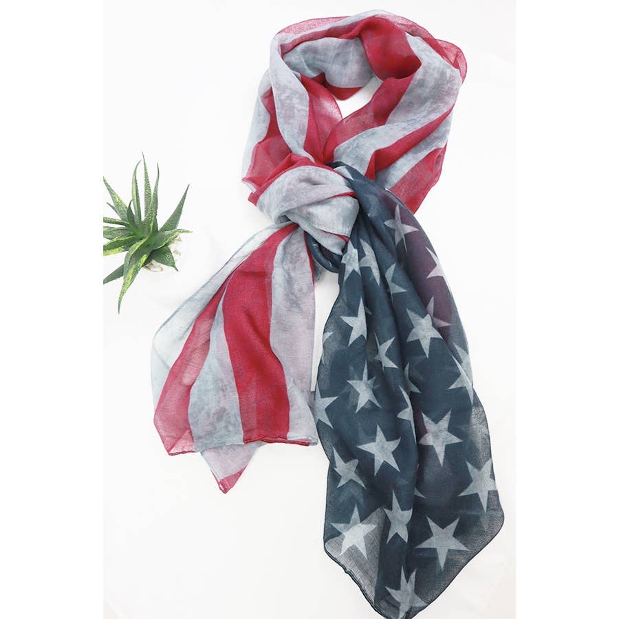 American Flag oblong scarf by Love and Repeat featuring red, white, and blue stars and stripes, lightweight and stylish accessory.
