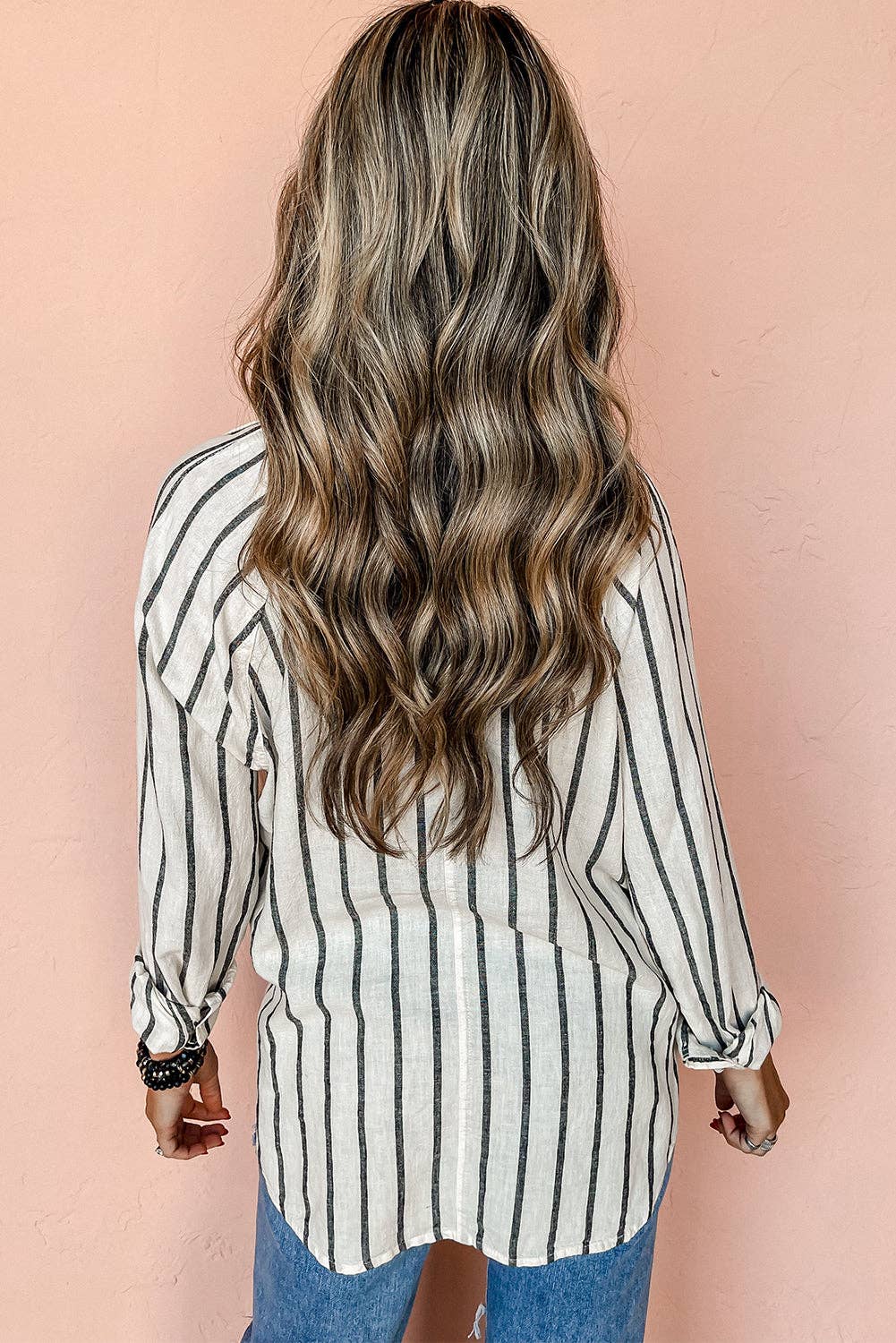 Lovesoft striped oversized buttoned shirt with chest pocket, featuring a relaxed fit and classic pattern, displayed on a hanger.