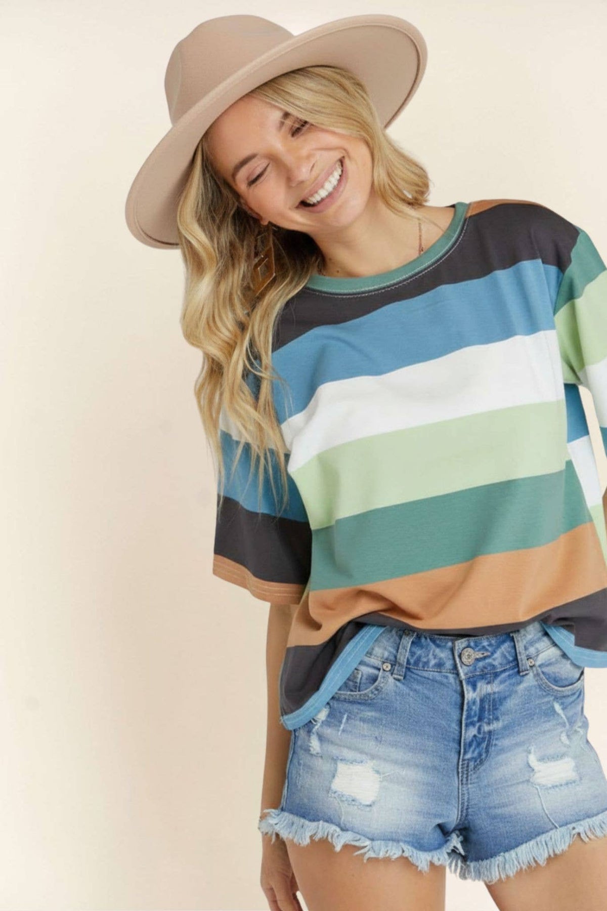 Madelyn multi-color stripe cotton top featuring a casual fit and vibrant horizontal stripes on soft fabric.