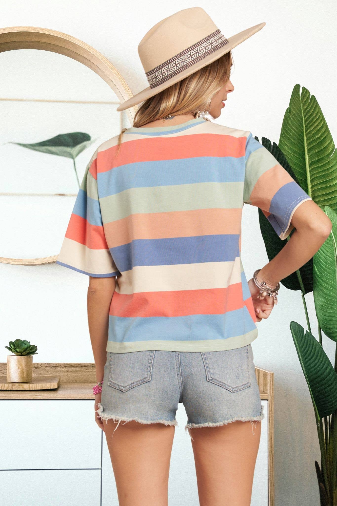 Multicolor striped cotton top by Madelyn, showcasing a vibrant, casual design with long sleeves and a relaxed fit.