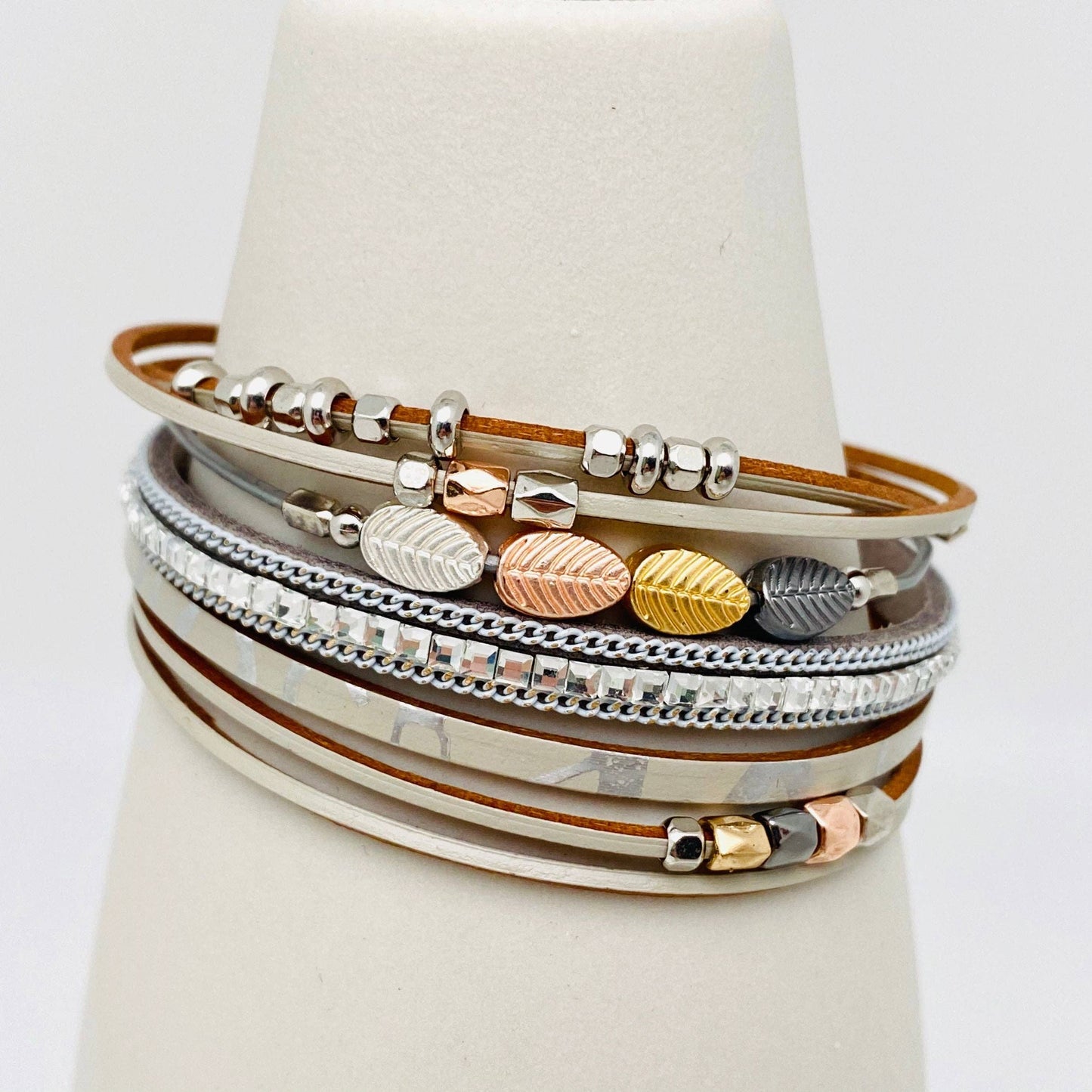 Bohemian style leather multi-layer bracelet bangle by Mio Queena featuring mixed leather strands and metal accents.