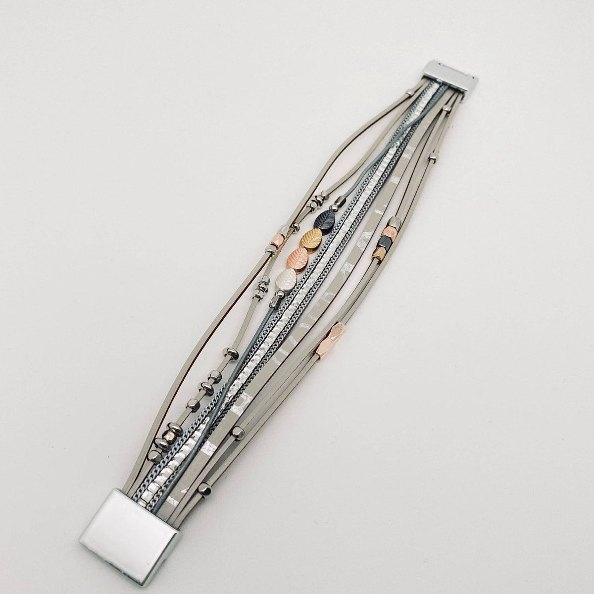 Bohemian style leather multi-layer bracelet bangle by Mio Queena with various layered leather strands and metal accents.