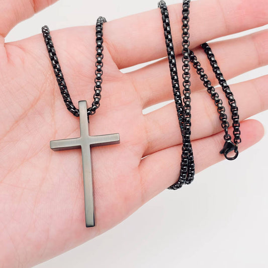 Glossy black stainless steel cross pendant necklace by Mio Queena, featuring a sleek and shiny design.