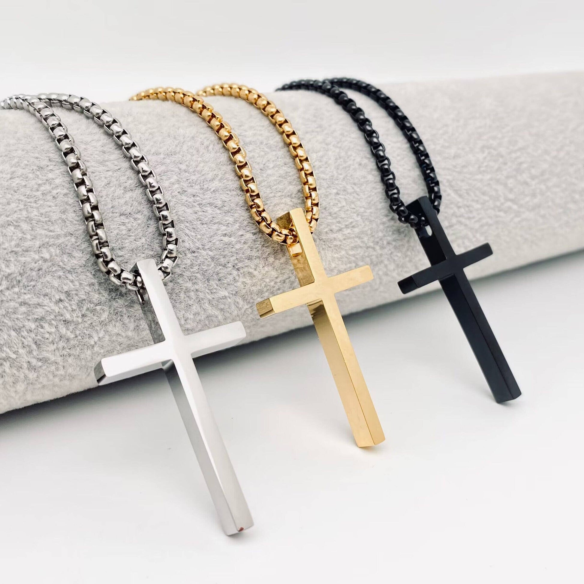 Glossy black stainless steel pendant necklace by Mio Queena featuring a sleek cross design.