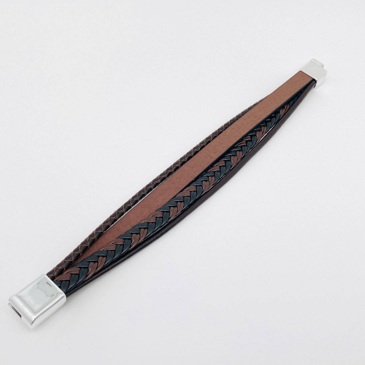 Handmade leather cross men's bracelet with magnetic buckle by Mio Queena, featuring dark leather strap and silver cross detail.