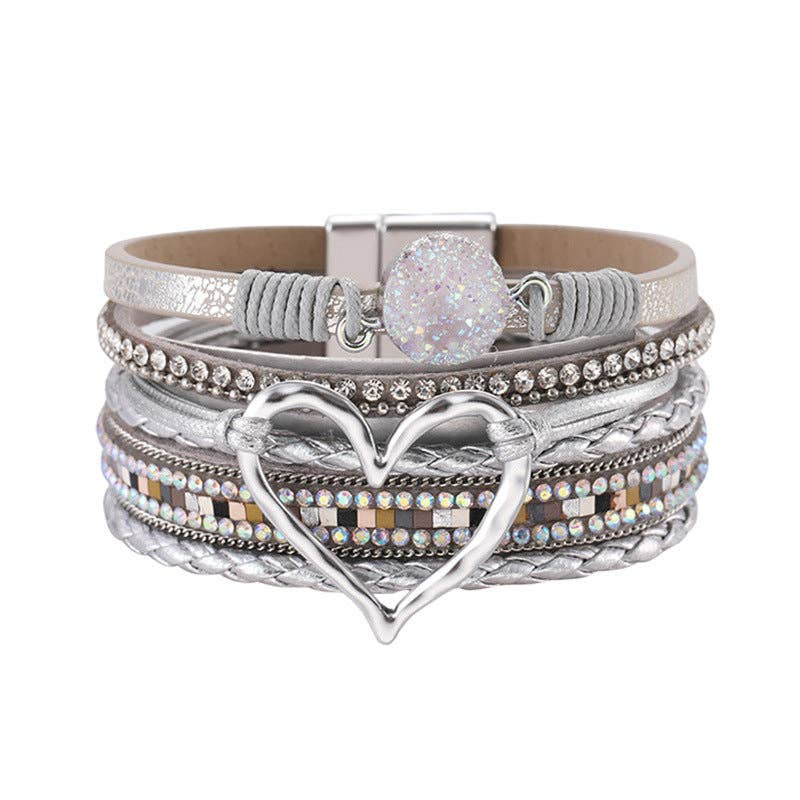 Blue Mio Queena multi-layer heart charm bangle bracelet with layered gold-tone chains and heart pendants on a white background.