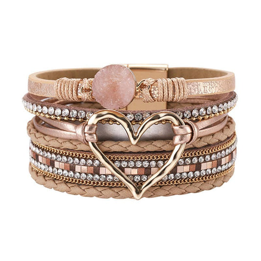 Gold multi-layer heart charm bangle bracelet by Mio Queena, featuring layered metal design and delicate heart-shaped charms.