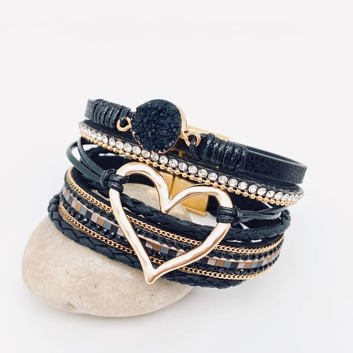 Red multi-layer heart charm bangle bracelet by Mio Queena, featuring layered design and delicate heart charms on a sleek bracelet.