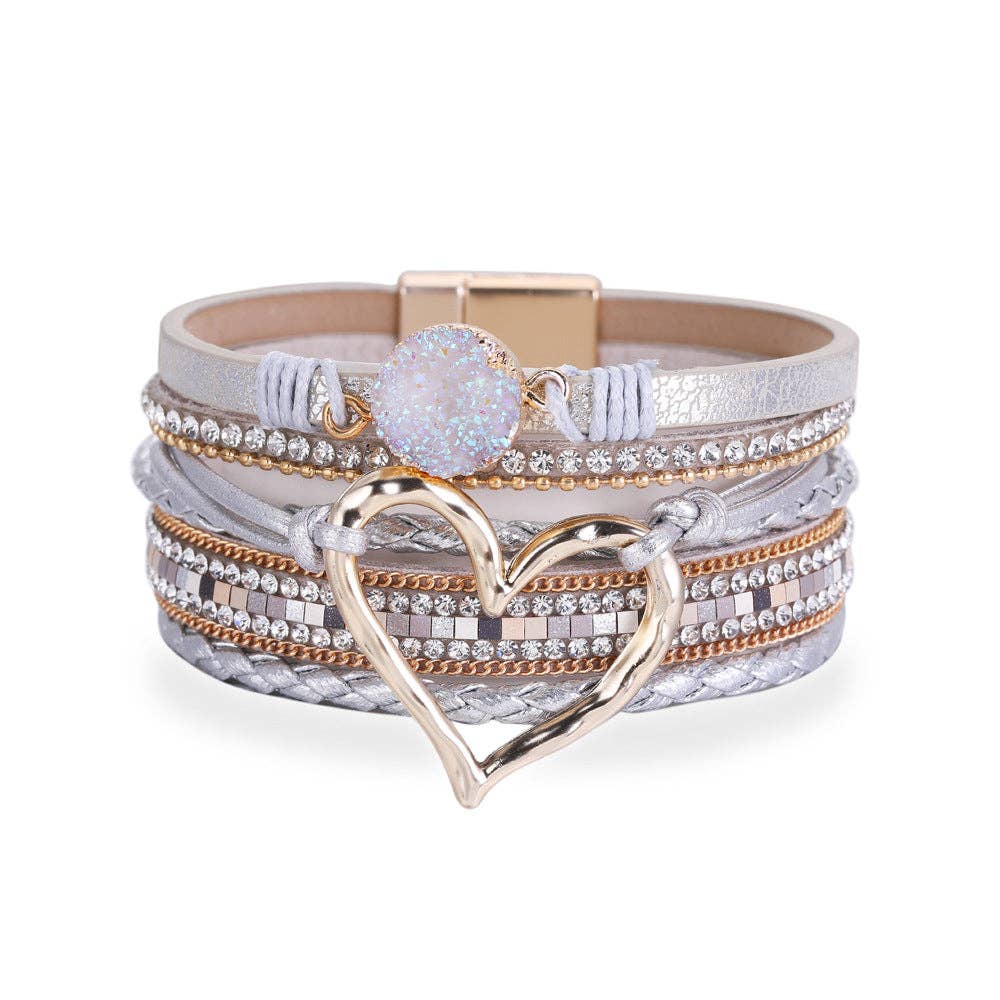 Silver multi-layer heart charm bangle bracelet by Mio Queena, featuring layered design and delicate heart pendants.