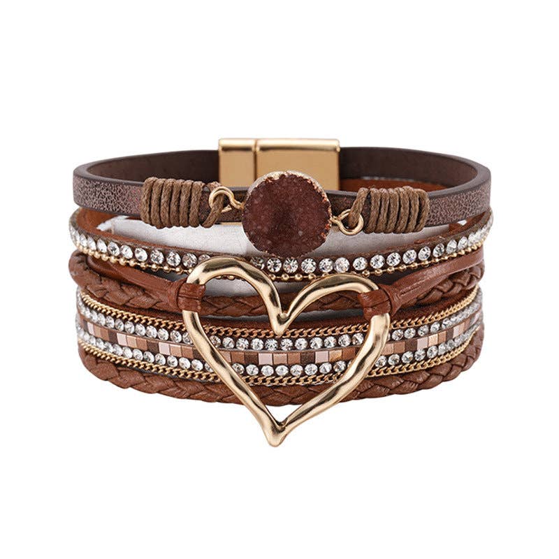 Silver Mio Queena multi-layer heart charm bangle bracelet with layered design and multiple heart charms on a sleek silver band.