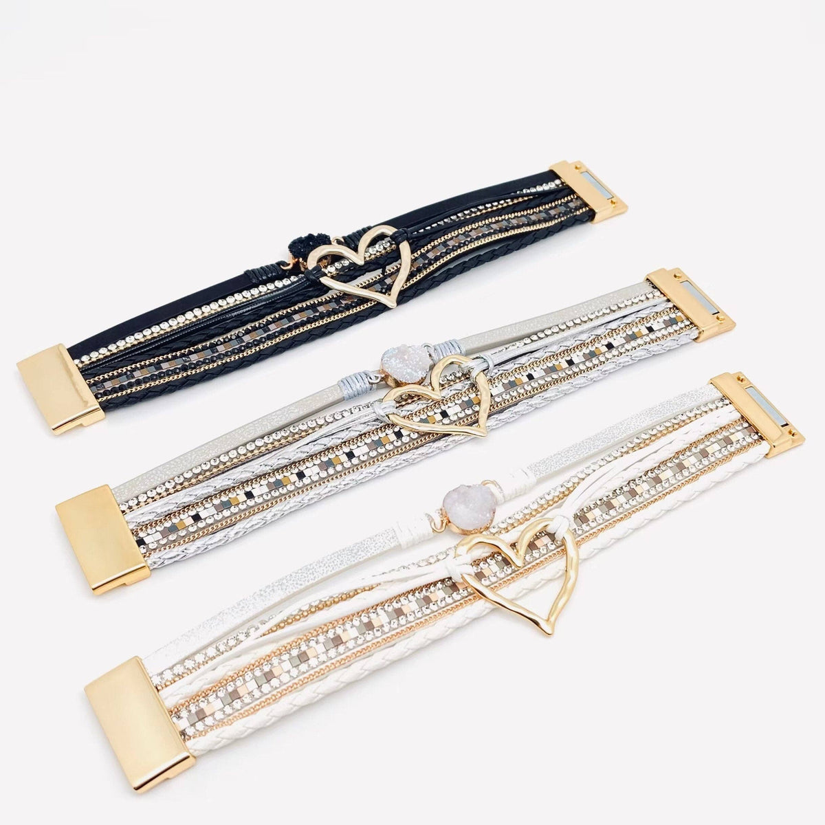 Silver multi-layer heart charm bangle bracelet by Mio Queena featuring layered design and delicate heart charms.