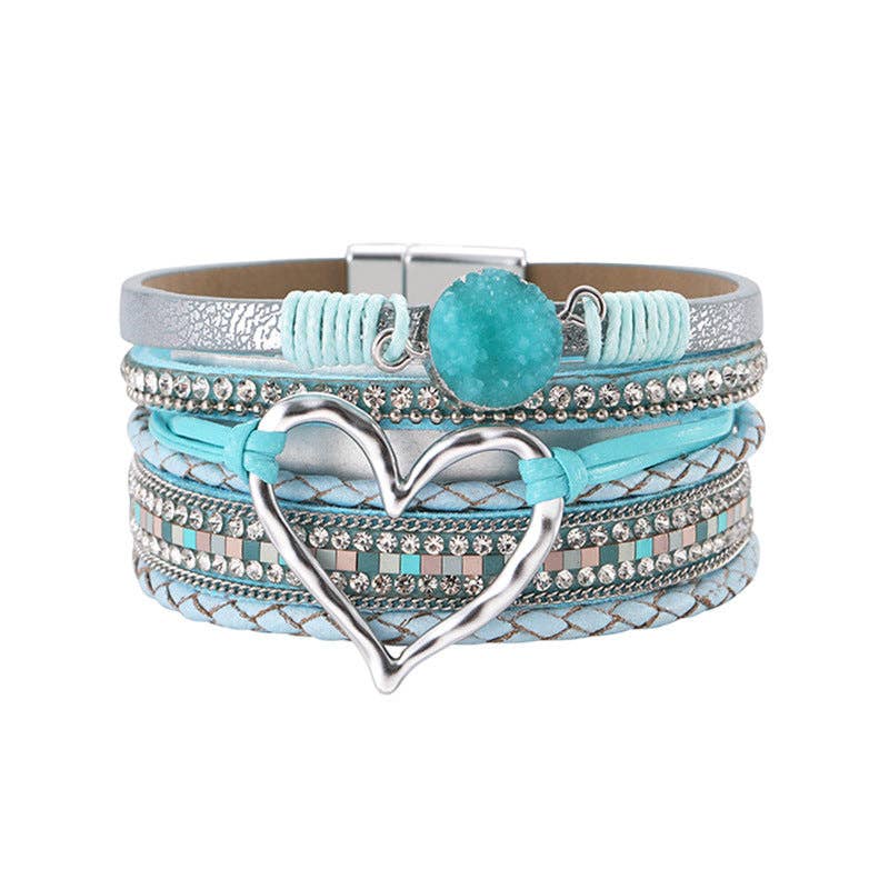 Silver Mio Queena multi-layer heart charm bangle bracelet with layered design and intricate heart details on a white background.