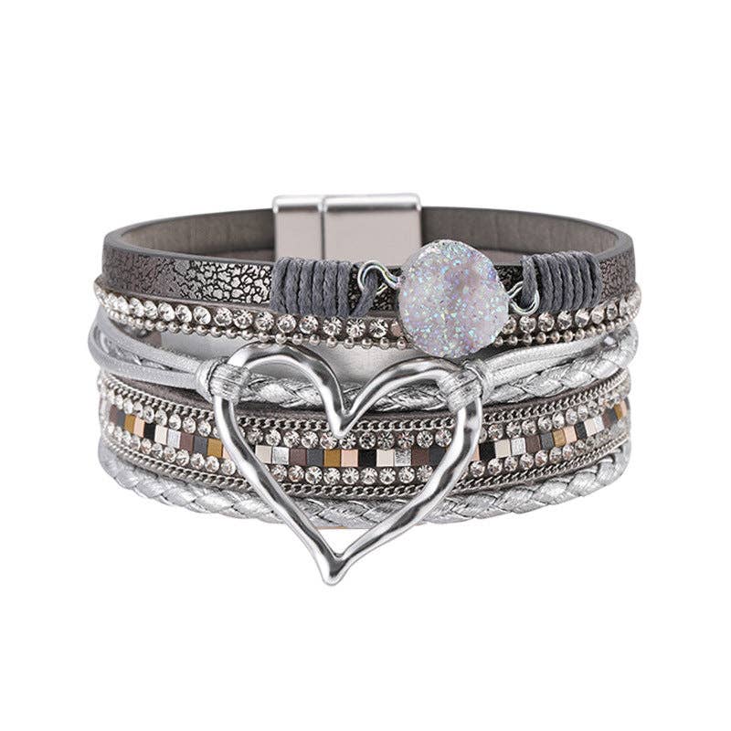 Silver multi-layer heart charm bangle bracelet by Mio Queena featuring layered silver chains and heart pendants.