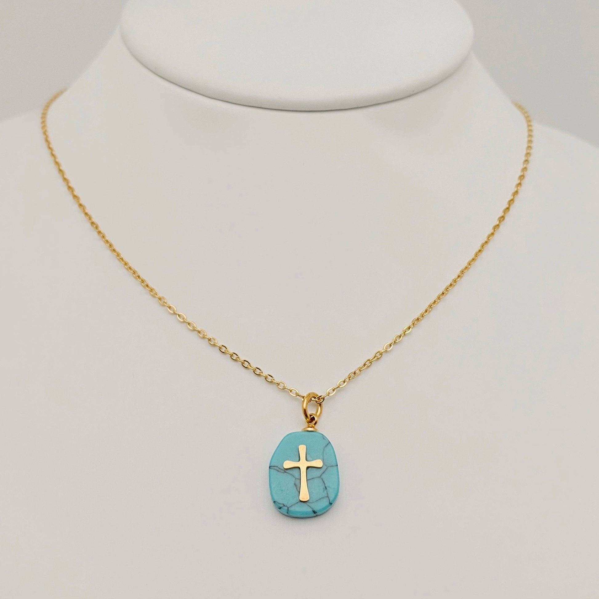 White natural stone stainless steel cross pendant necklace by Mio Queena, showcasing a sleek cross design against a neutral background.