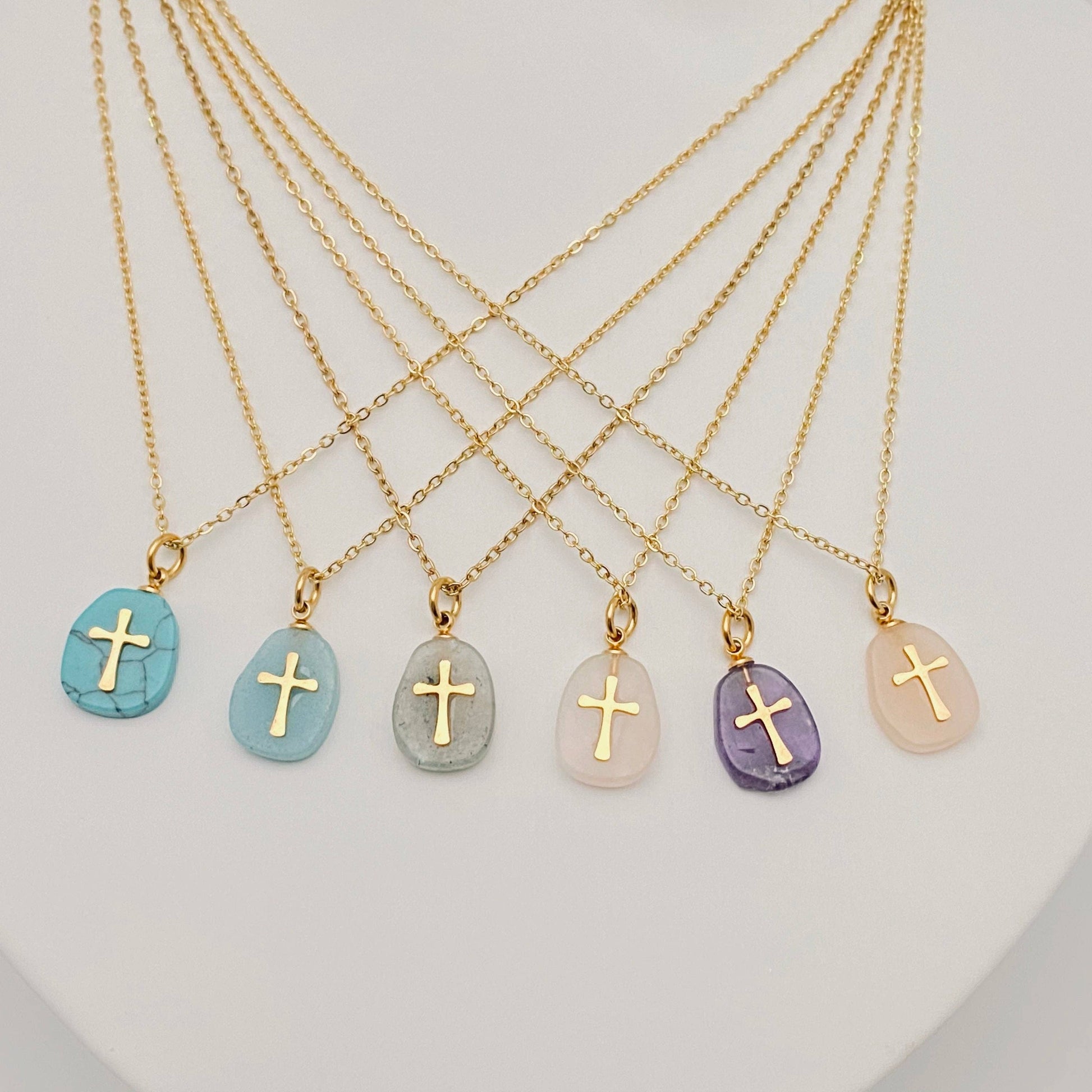 Turquoise blue natural stone stainless steel cross pendant necklace by Mio Queena, featuring a polished cross design.