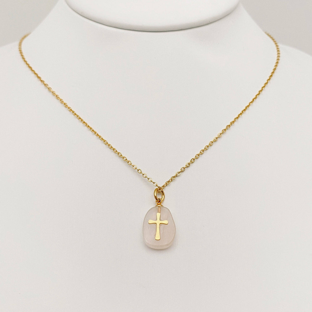Turquoise blue natural stone stainless steel cross pendant necklace by Mio Queena, featuring a detailed cross design on a sleek chain.