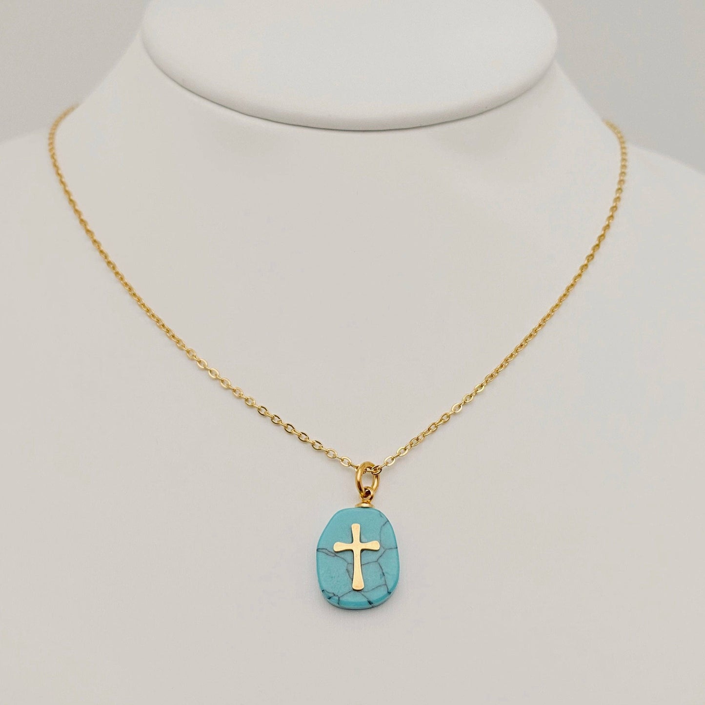 Natural green stone stainless steel cross pendant necklace by Mio Queena, featuring a polished cross design with a green stone accent.