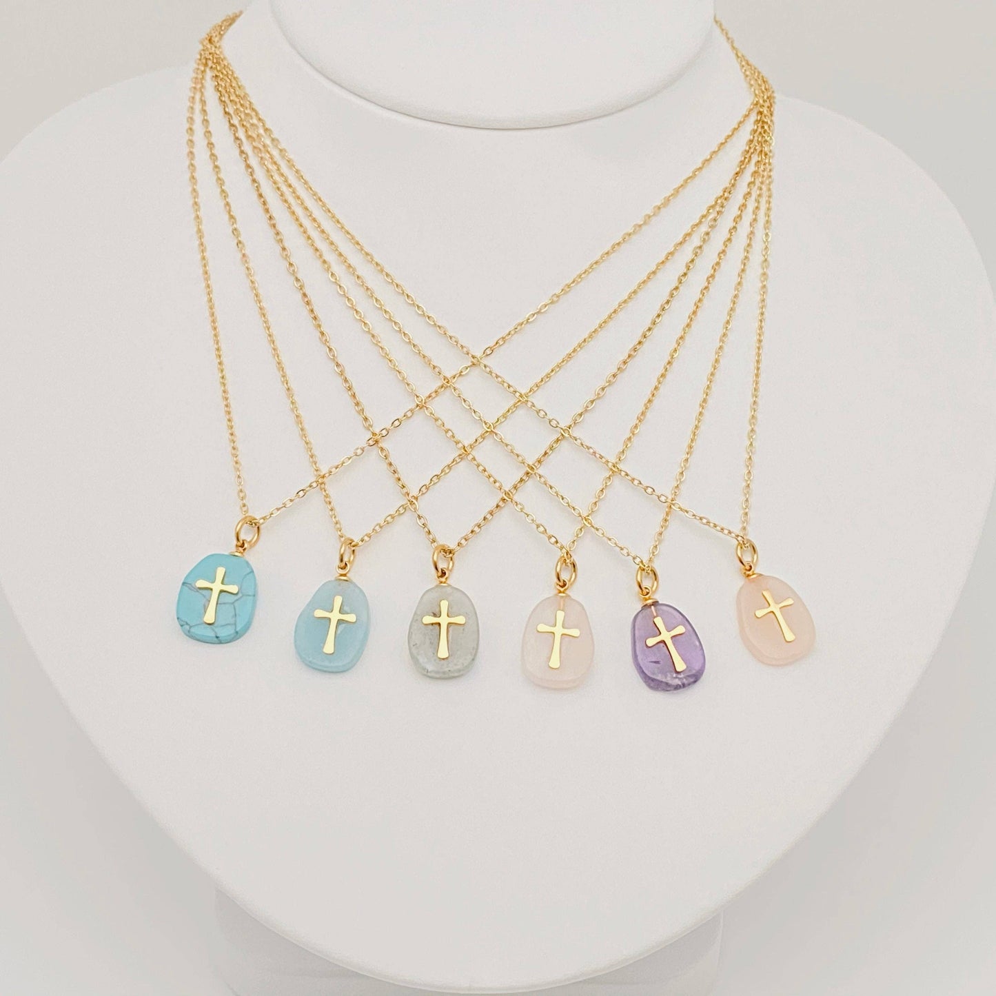 Mio Queena natural green stone stainless steel cross pendant necklace, close-up of the elegant religious jewelry design