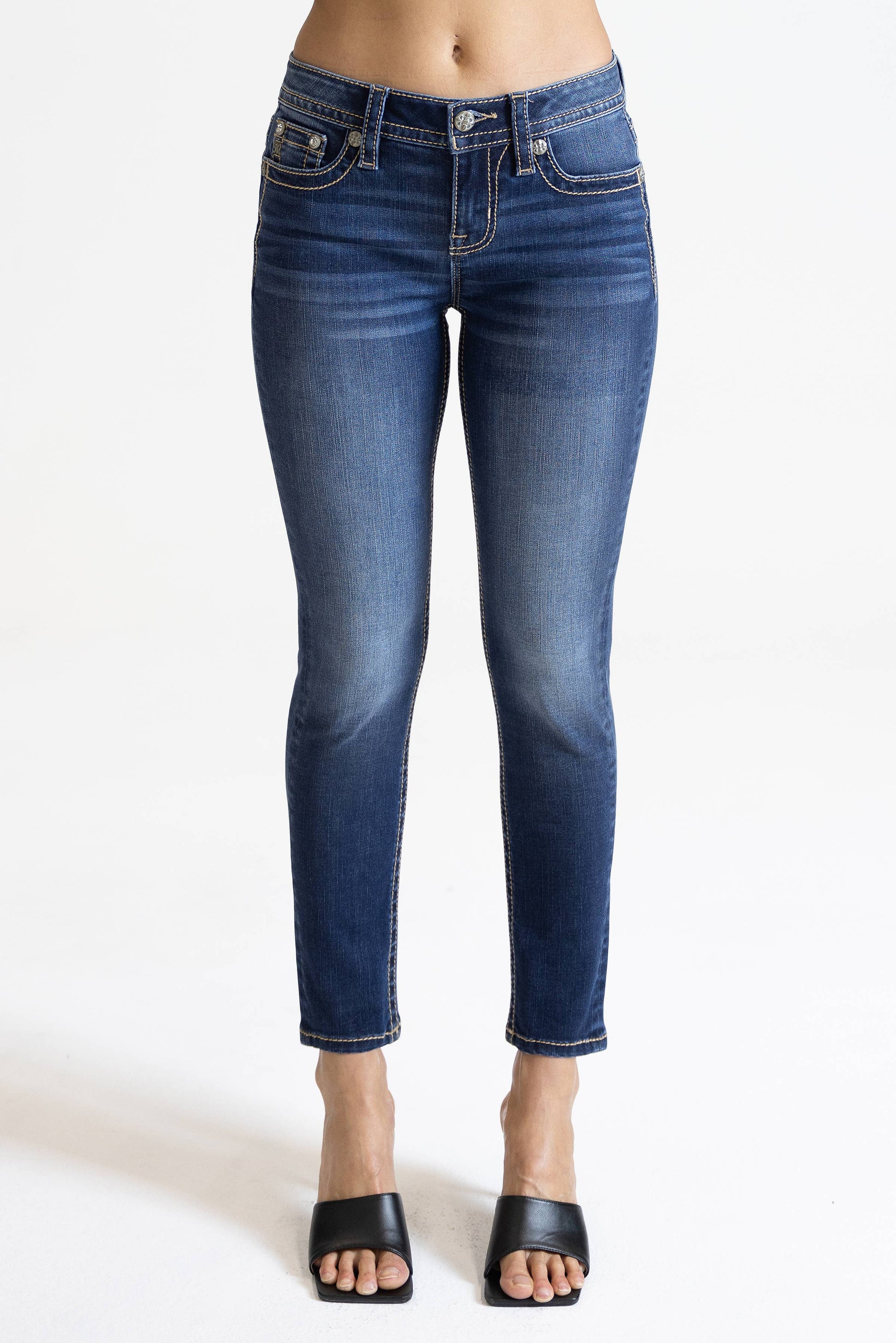 Miss Me 29-inch midrise skinny jeans in classic denim, showing fitted silhouette and front pockets