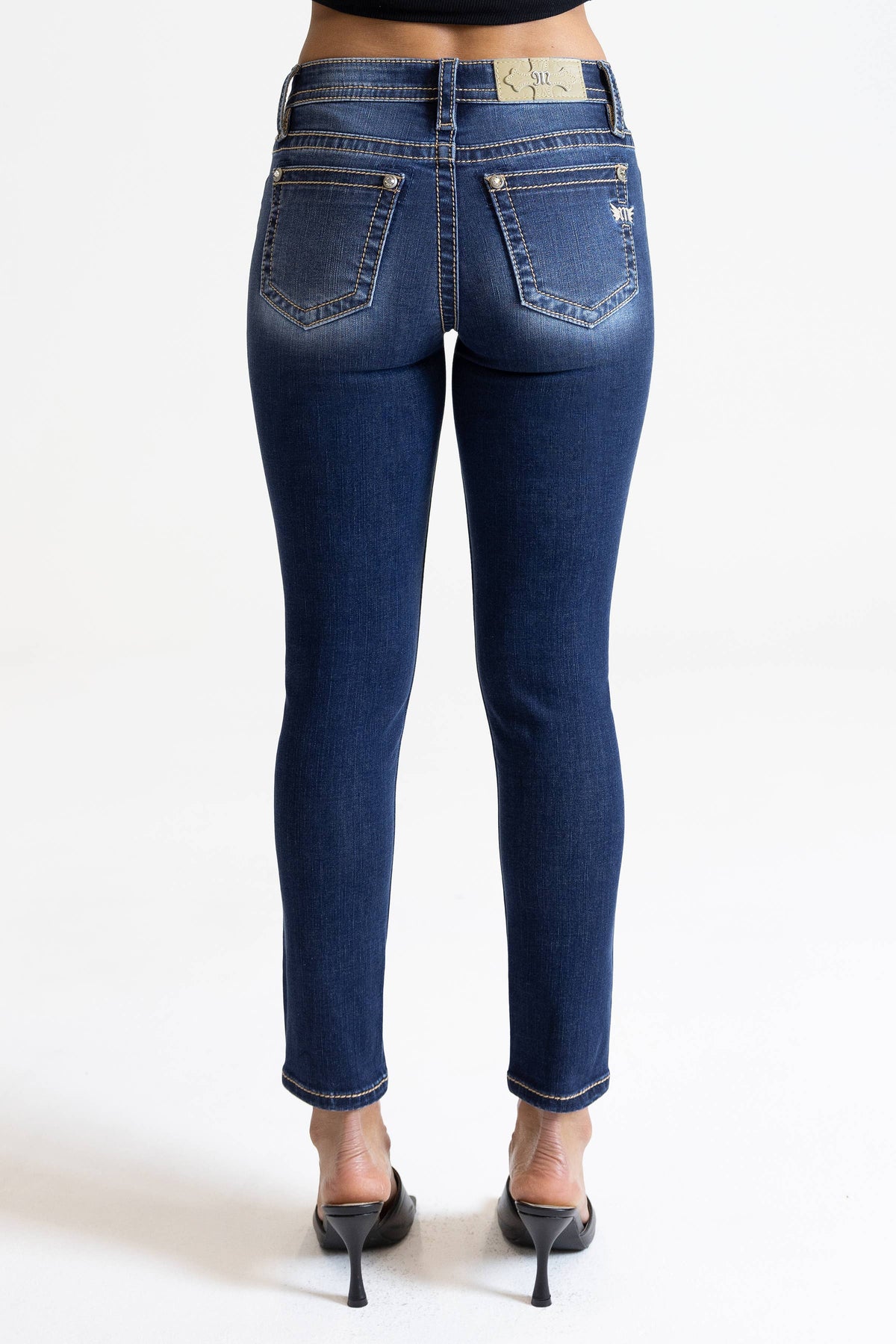 Miss Me 29-inch midrise skinny jeans featuring classic denim fabric, front pockets, and a fitted silhouette.