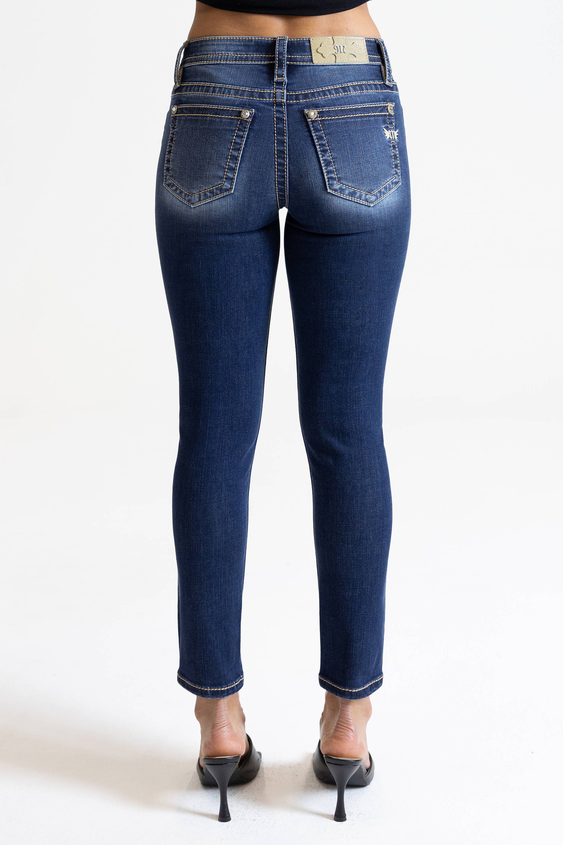 Miss Me 29-inch midrise skinny jeans featuring classic denim fabric, front pockets, and a fitted silhouette.
