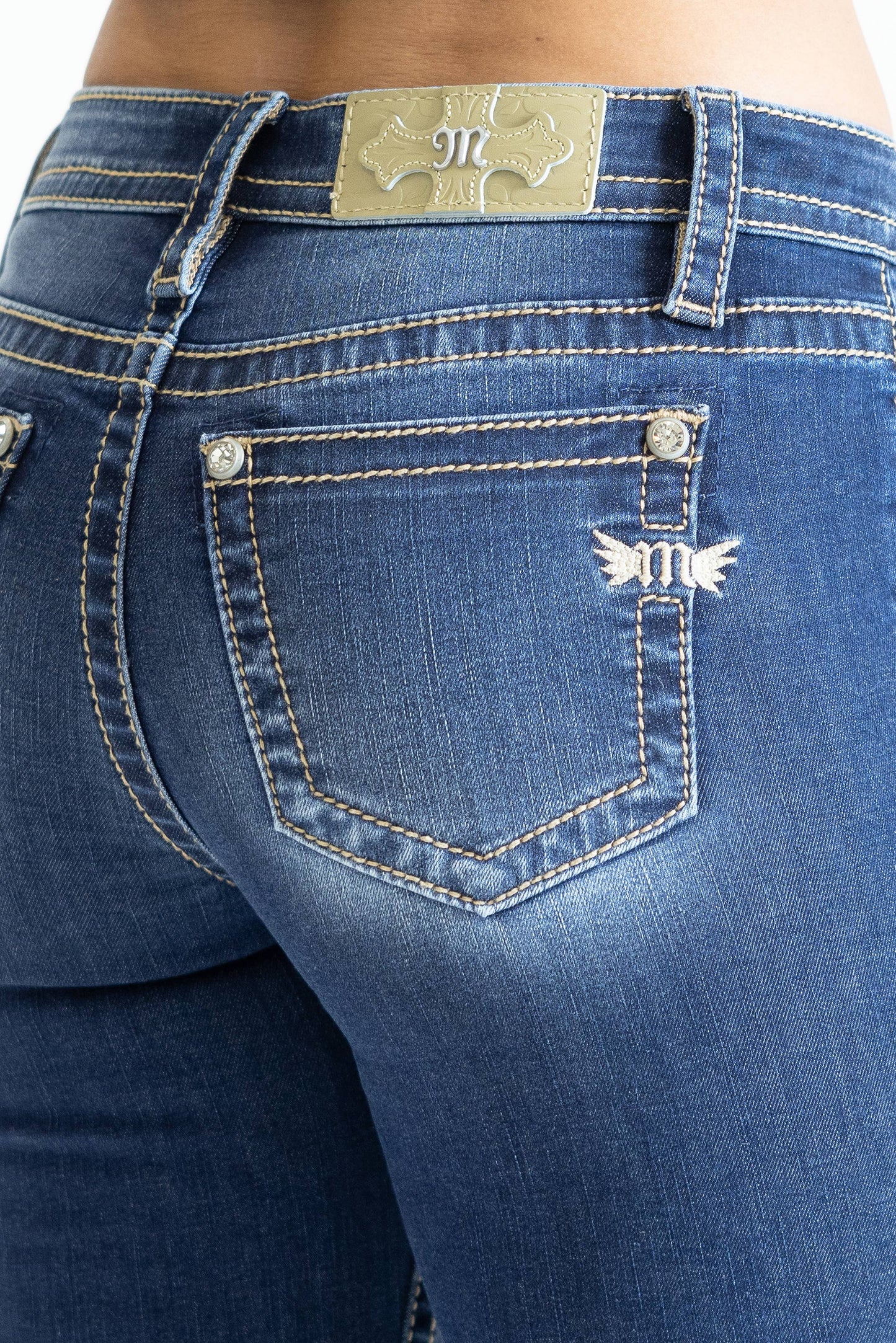 Miss Me 29-inch midrise skinny jeans shown in dark denim with classic five-pocket design and subtle fading.