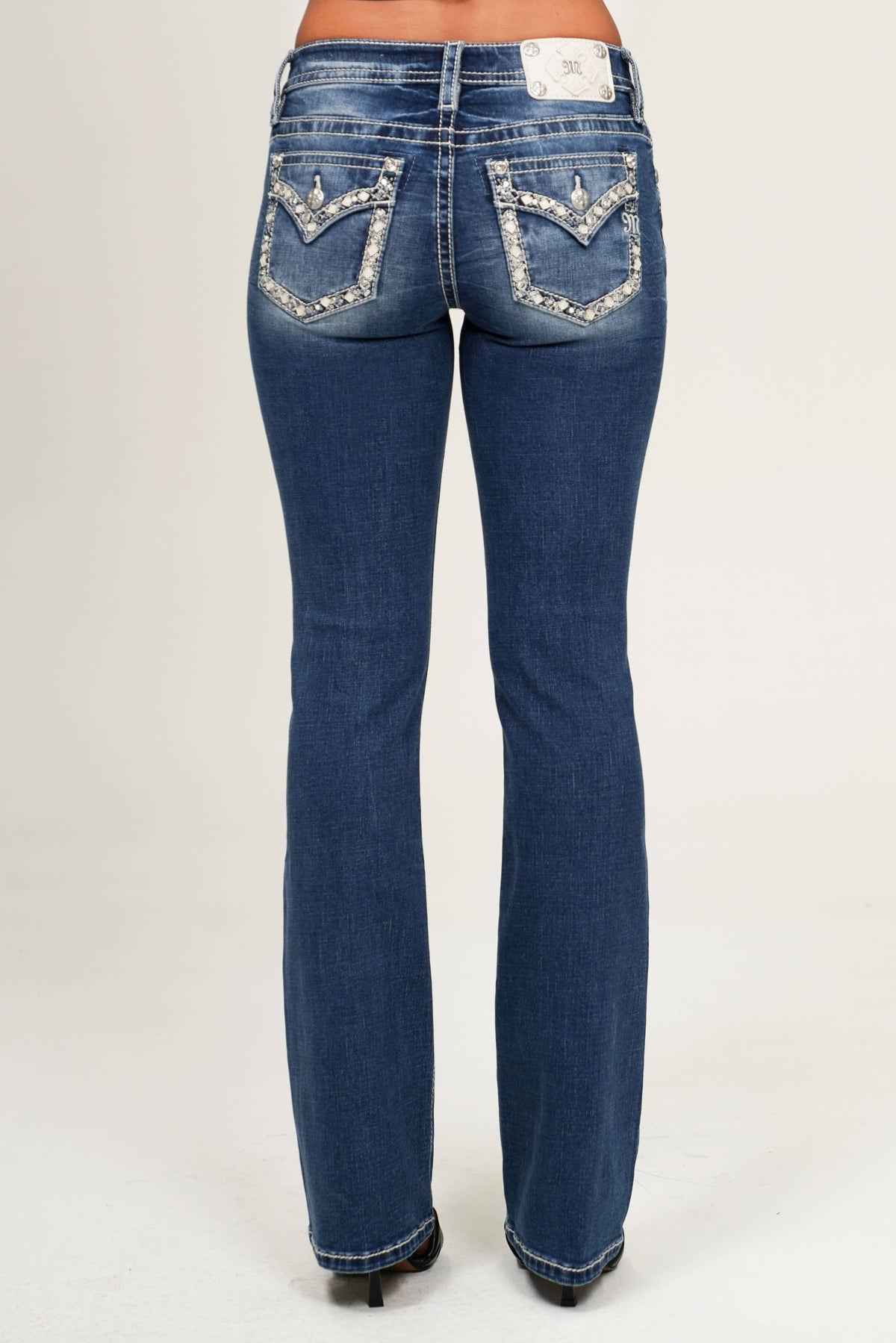 Miss Me 30 Mid Rise Boot Cut Jean in style M9517BS, showing the classic denim fabric and boot cut silhouette.
