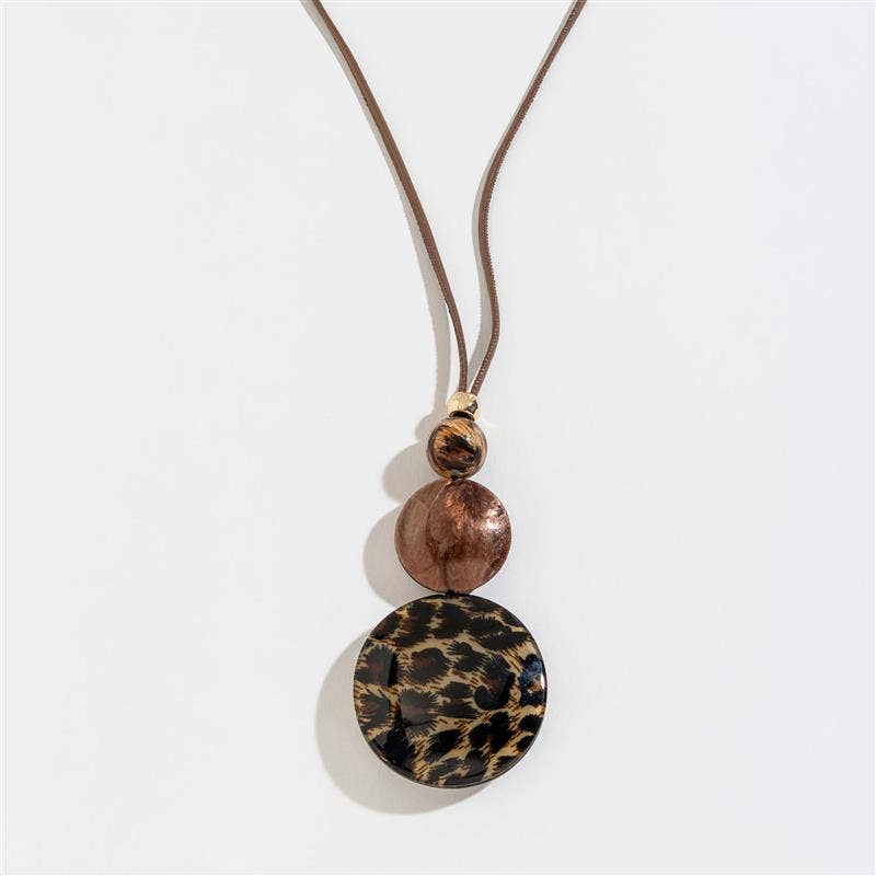 Cheetah print bubble disc and corded Y-neck necklace featuring bold animal print and layered design, stylish accessory for outfits.