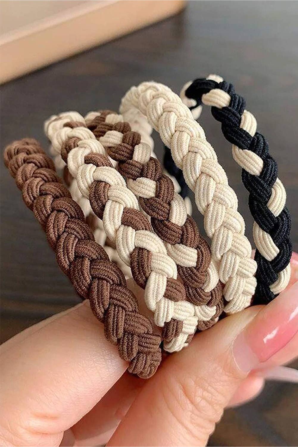 Set of five smile face braided hair ties with colorful designs, perfect for kids' hairstyles and hair accessories.
