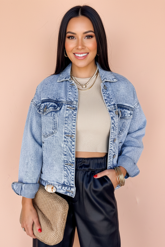 Beau Blue vintage washed denim jacket by Chic Speak Boutique with flap pockets and classic fit, displayed on a hanger.