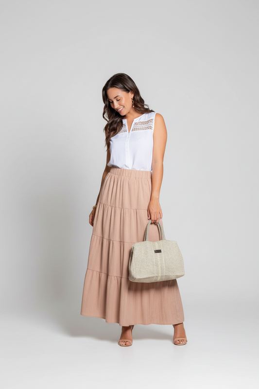 Howard's Indie sleeveless white V-neck tank top blouse with a relaxed fit and smooth fabric, displayed on a hanger.