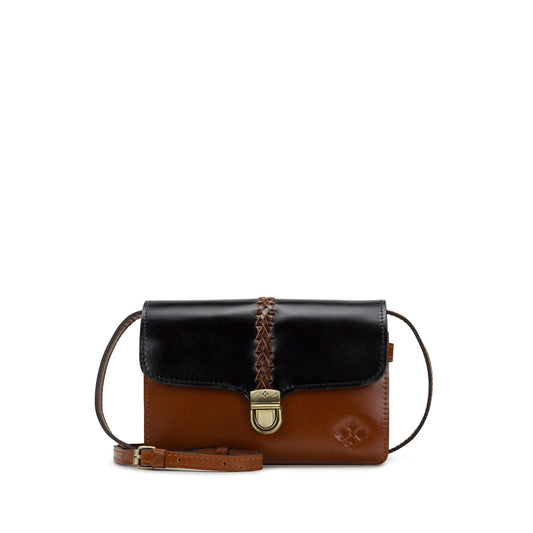 Patricia Nash Bianco Crossbody bag in colorblock design with adjustable strap and zip closure, featuring stylish leather accents.