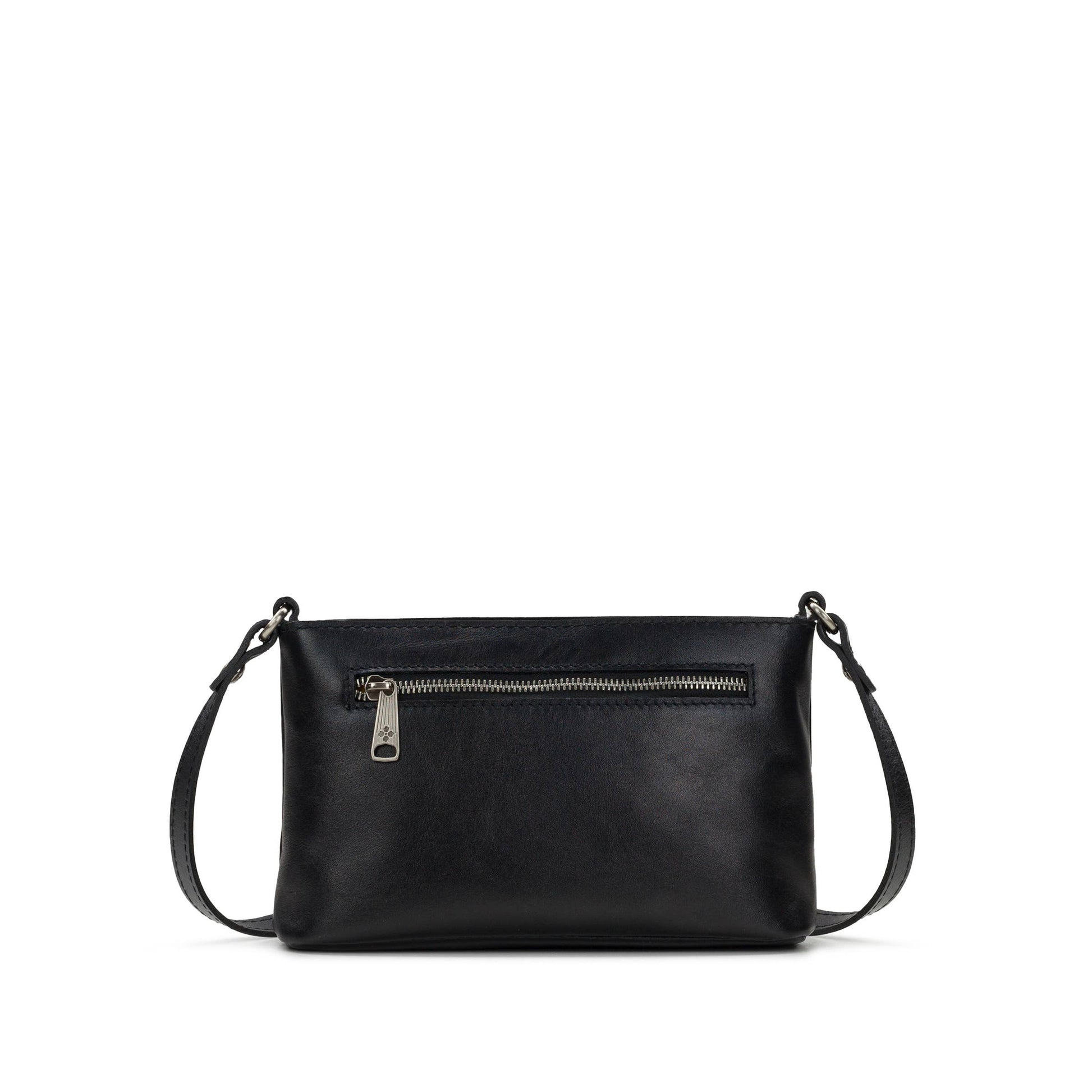 Black Patricia Nash Aimee crossbody bag with adjustable strap, featuring textured leather and classic design.